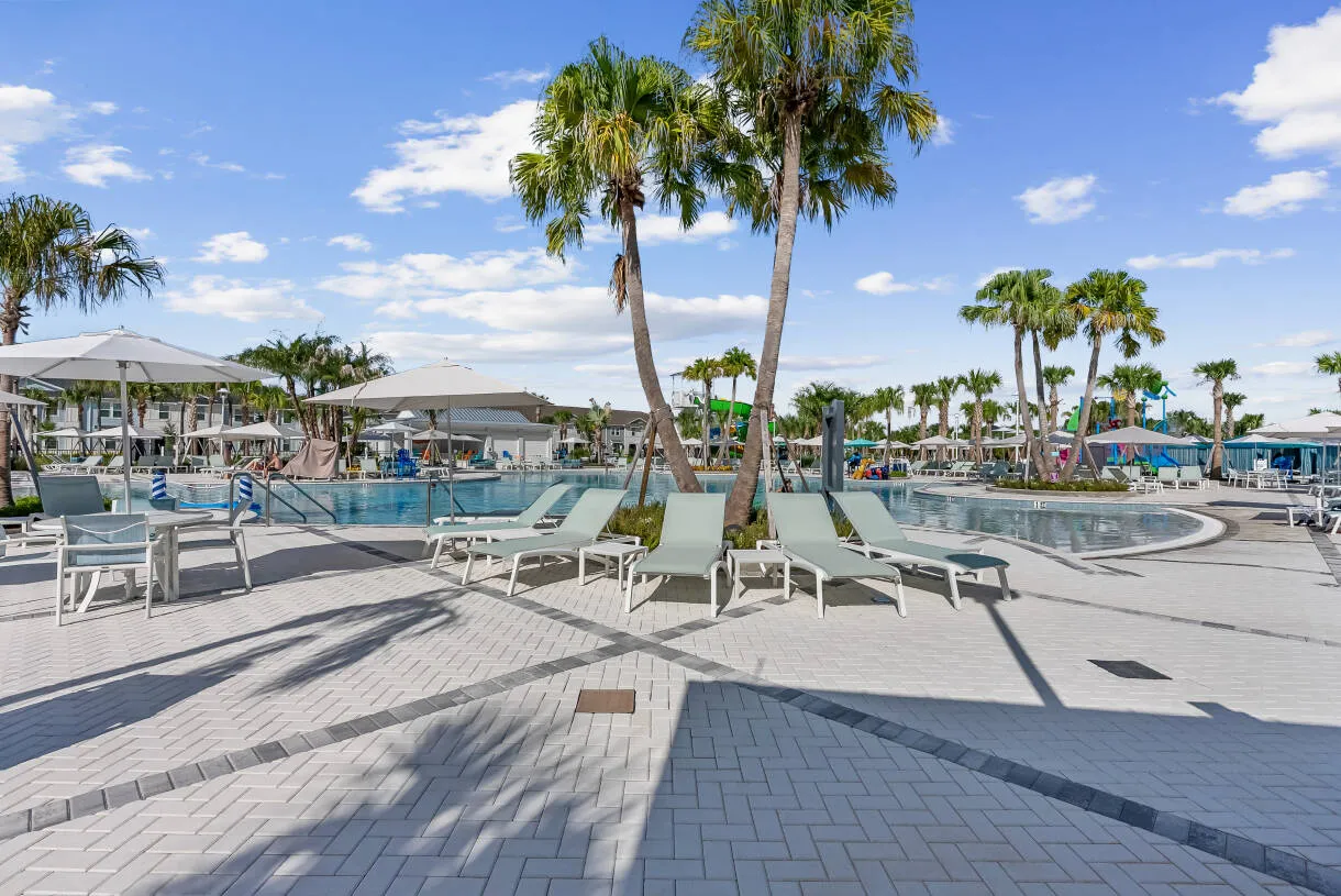 Resort-style pool with palms and loungers at Windsor Cay Resort.