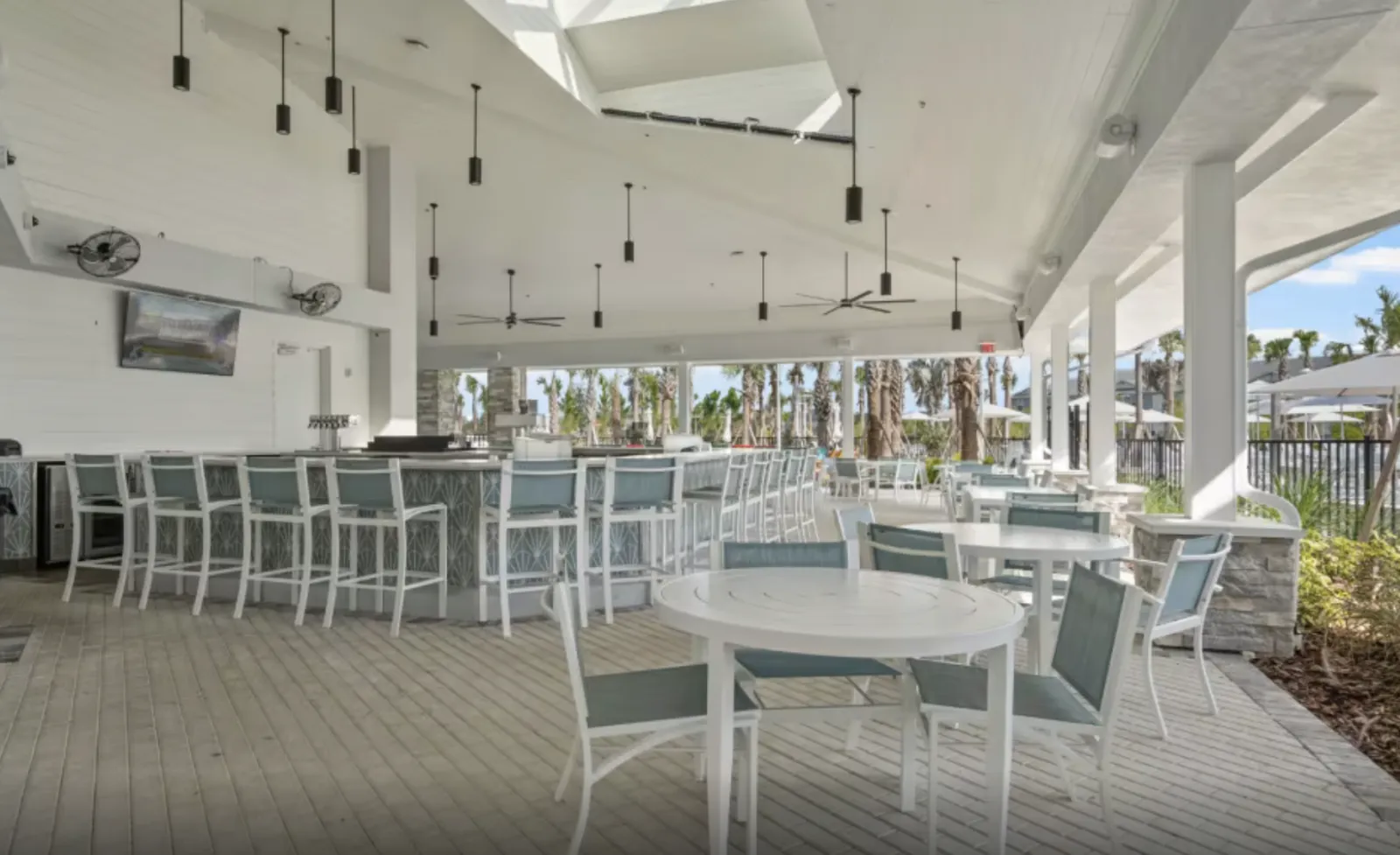 The Tavern & Grill (Blue Lagoon Bar & Grille) dining room and bar at the Reef Club, Windsor Cay Resort.