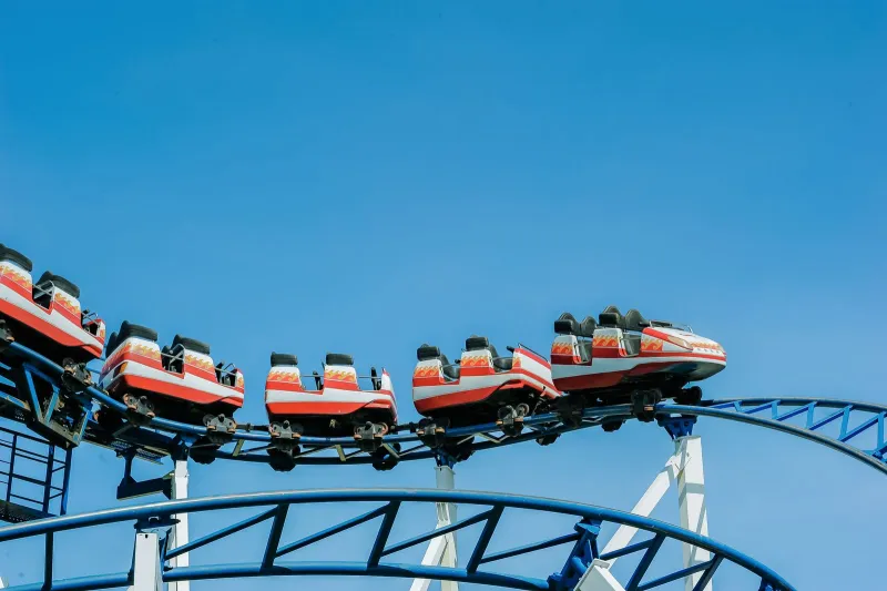 A roller coaster against a clear blue sky